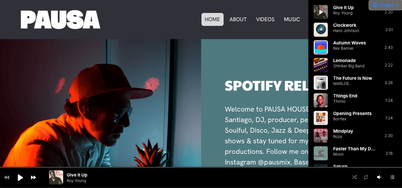 Music website with playlist, artist profile, and Spotify release information on a dark-themed interface.