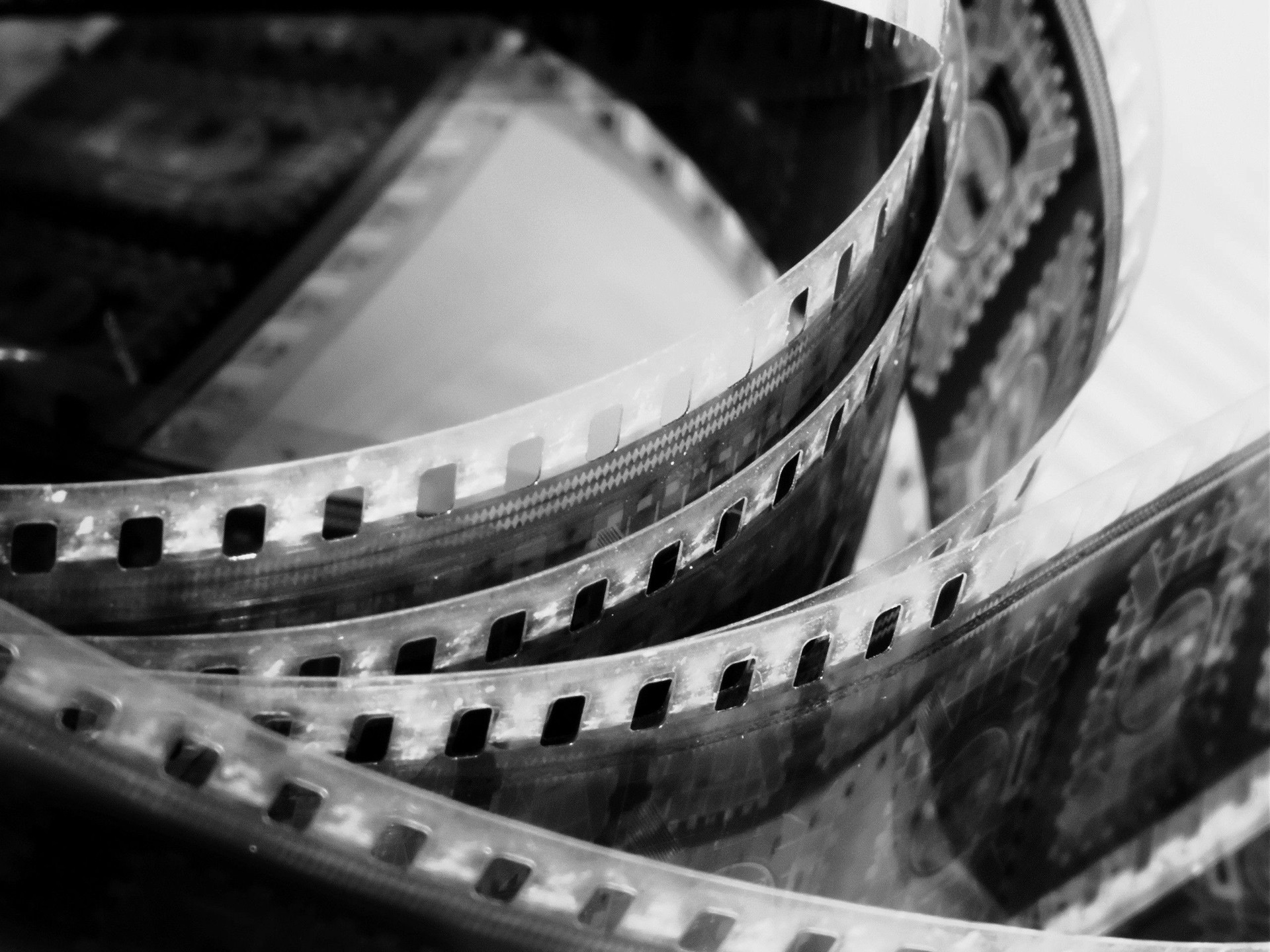 Close-Up of Vintage Film Reel with Cinematic Frames