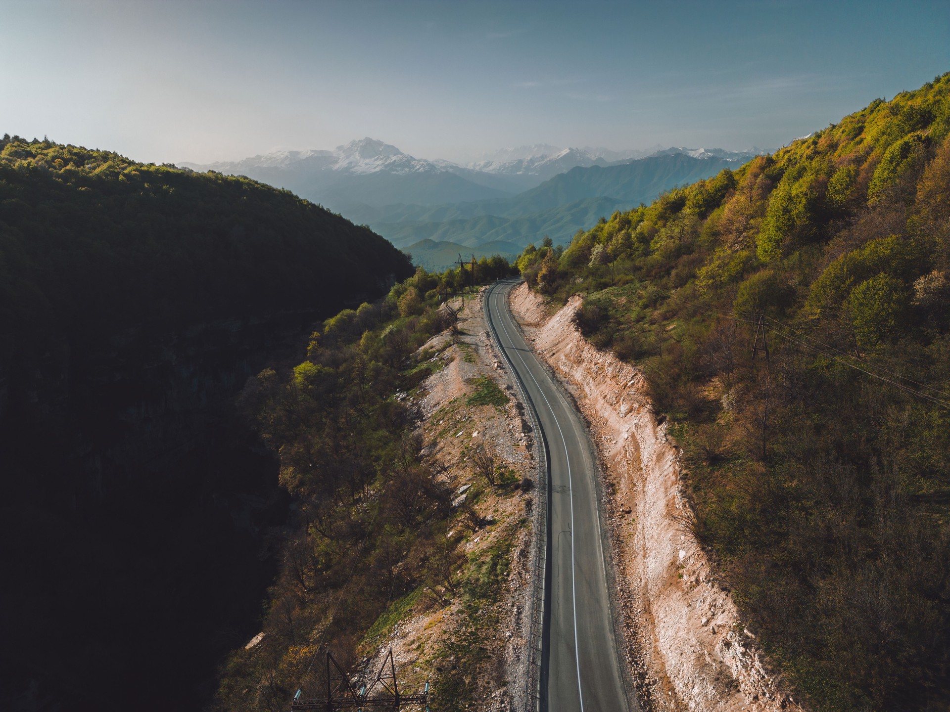 asphalt road through the pass, road high in the mountains, aerial view